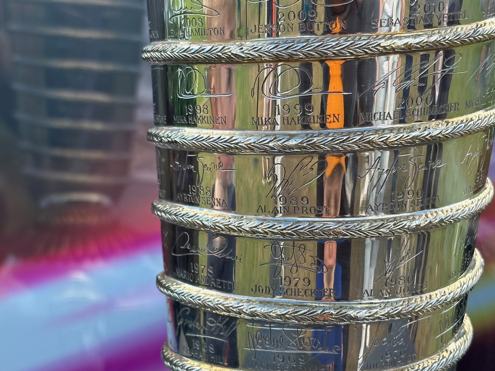 The Formula 1 Grand Prix trophy gleams under the Australian sun, capturing racing history's elite champions.