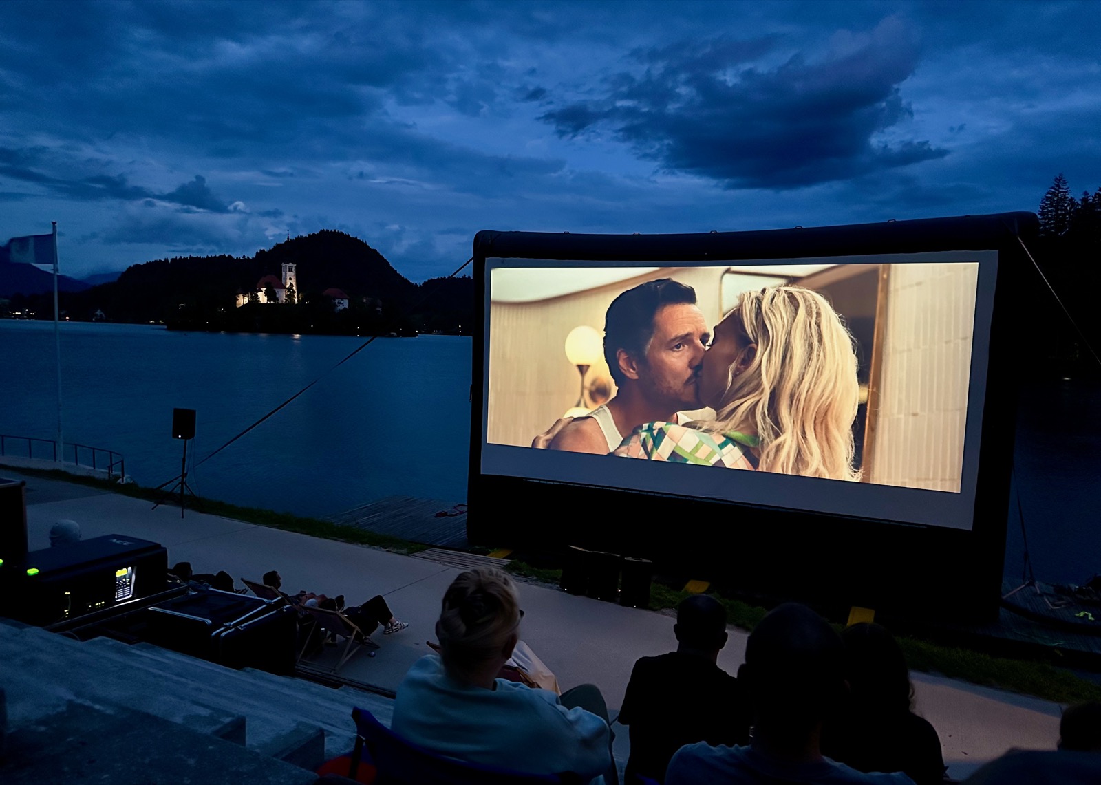 Projector screen showing a couple kissing.